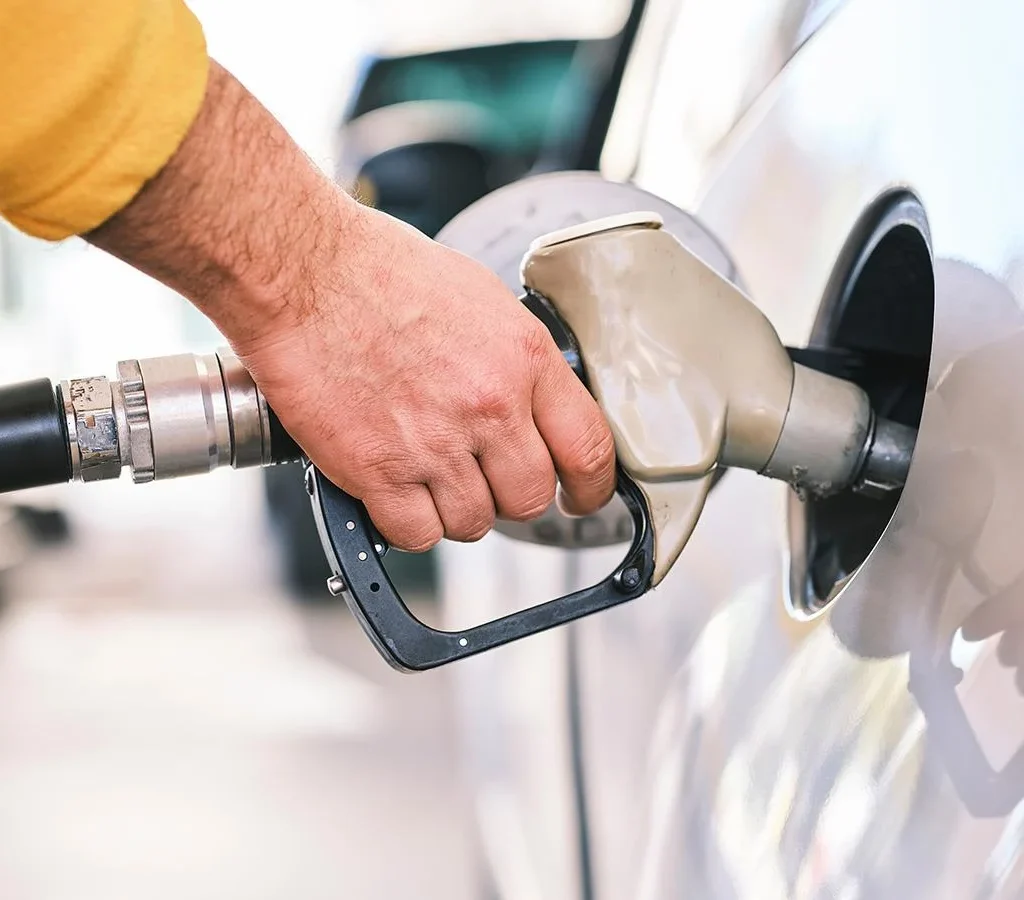person pumping gas 4x4 car rental rwanda